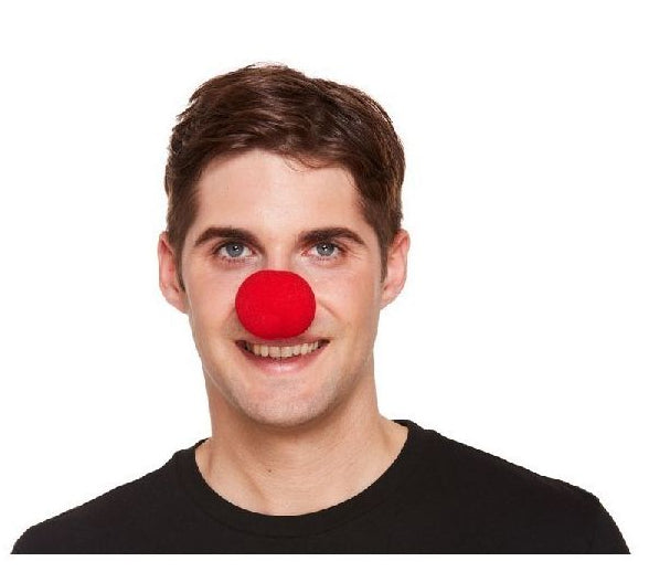 Person wearing a red clown nose on a white background