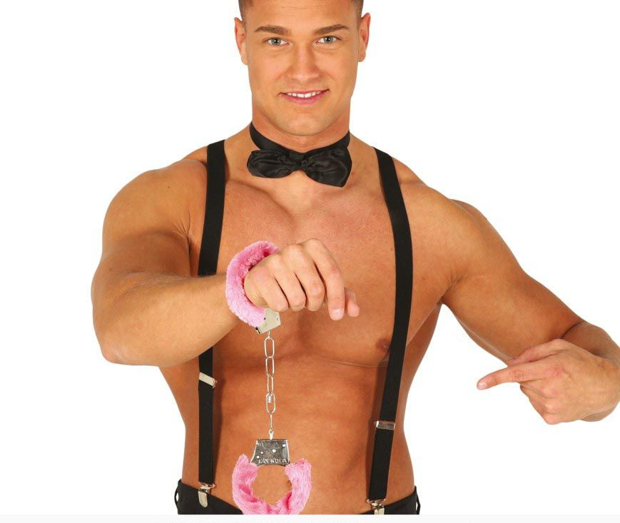 Man wearing suspenders and a bow tie, holding pink handcuffs on a white background