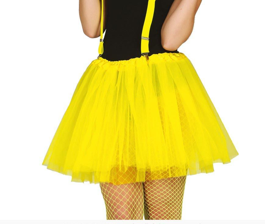 A bright yellow tulle tutu skirt with matching yellow suspenders, shown on a model from the back against a white background.