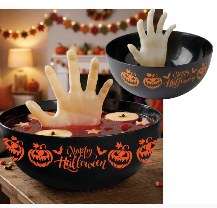 Black Halloween-themed bowl with orange 'Happy Halloween' script and pumpkin graphics, shown with a pale hand-shaped prop rising from red liquid inside. A smaller inset shows the bowl alone with the hand prop.