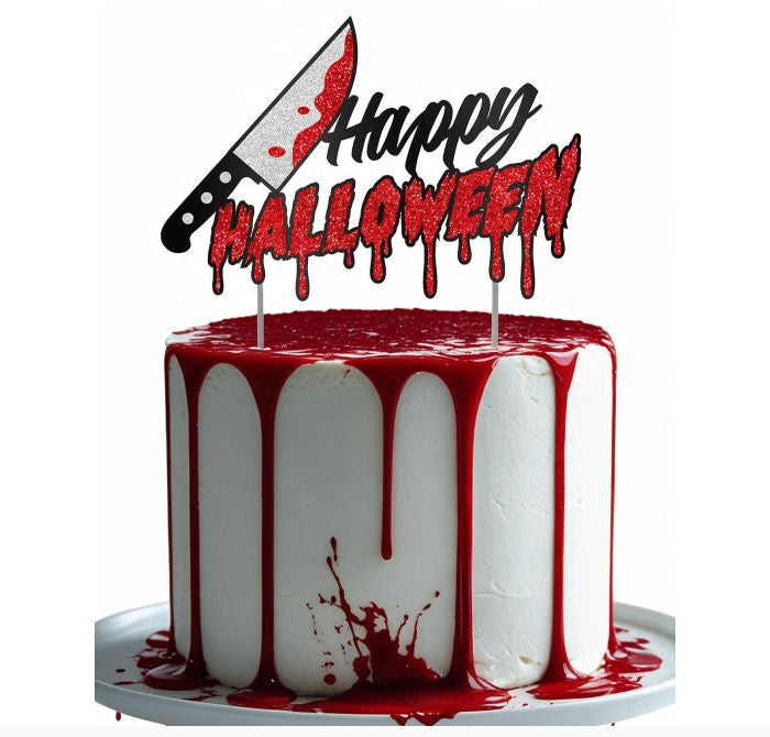 A Halloween-themed cake topper featuring a knife with red blood splatter and the words 'Happy HALLOWEEN' in dripping red lettering, shown on top of a white frosted cake with red blood-like drip decoration on a white background.