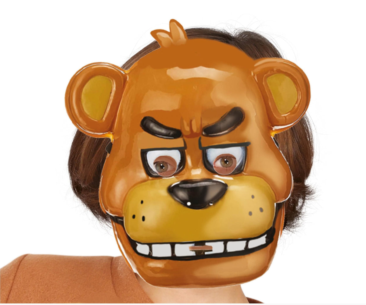 Brown mask with a bear design on a person against a white background