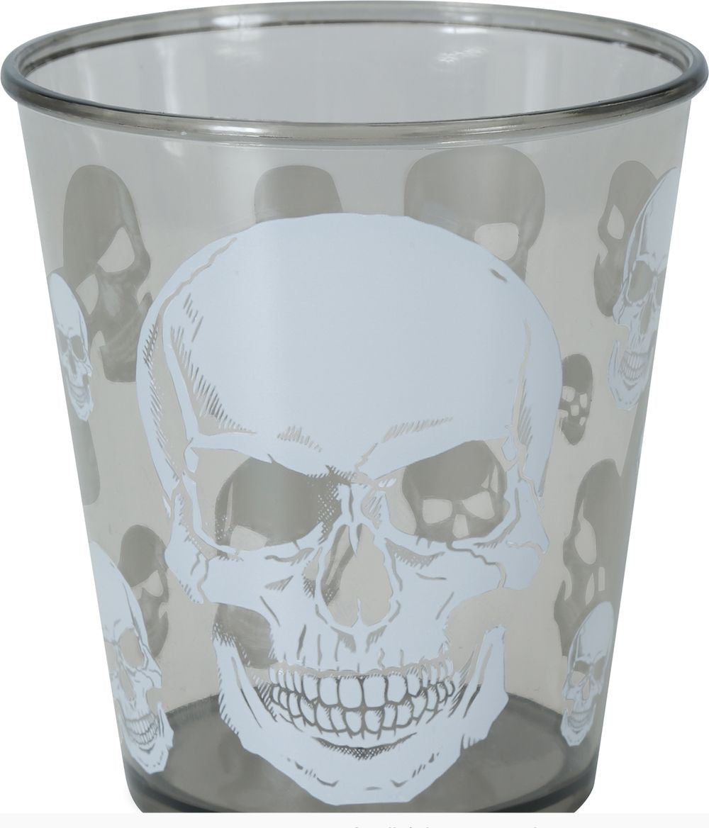 A clear drinking glass featuring a large white skull design on the front, surrounded by smaller matching skull motifs in the background. The glass is photographed against a plain white background, with a copyright notice for Fiestas Guirca s.