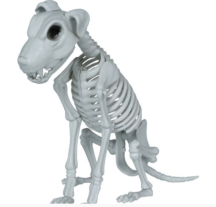 A small white dog skeleton figurine posed sitting, shown on a plain white background with a copyright notice for Fiestas Guirca s.j.