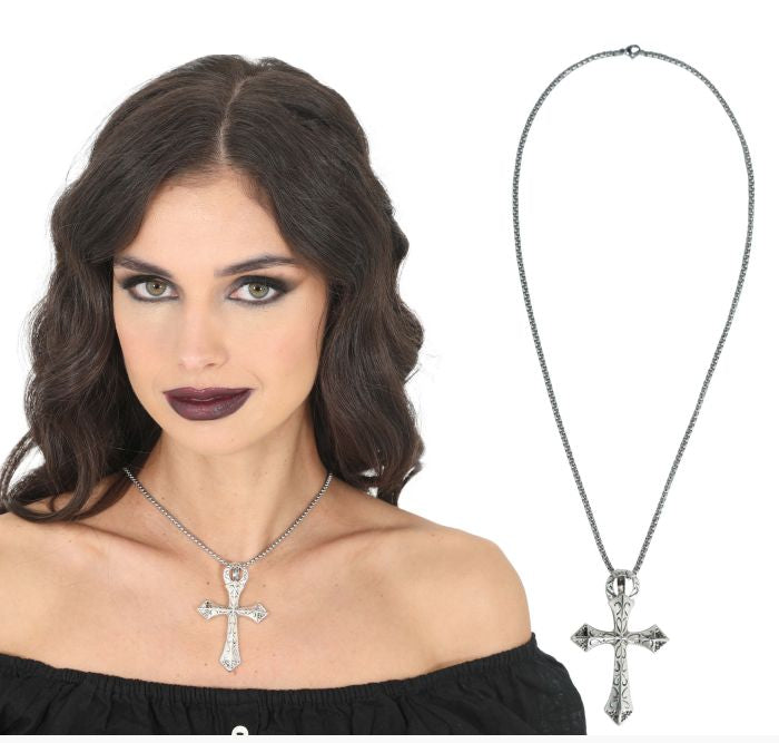 A silver-toned cross pendant necklace with clear rhinestones, shown worn by a woman on the left and as a standalone product shot on the right against a white background.