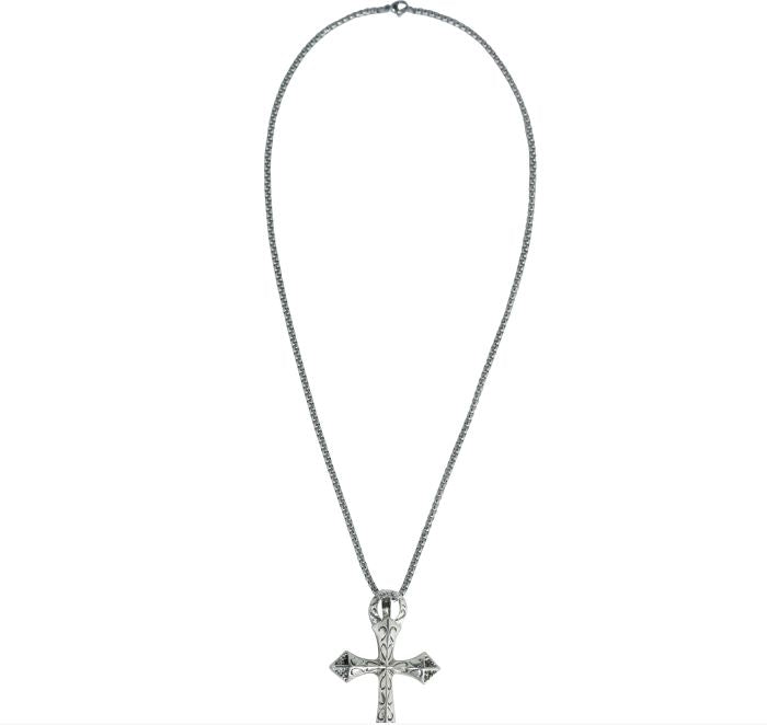 A silver-toned cross pendant necklace with a textured, diamond-like pattern, suspended on a fine silver chain against a white background.