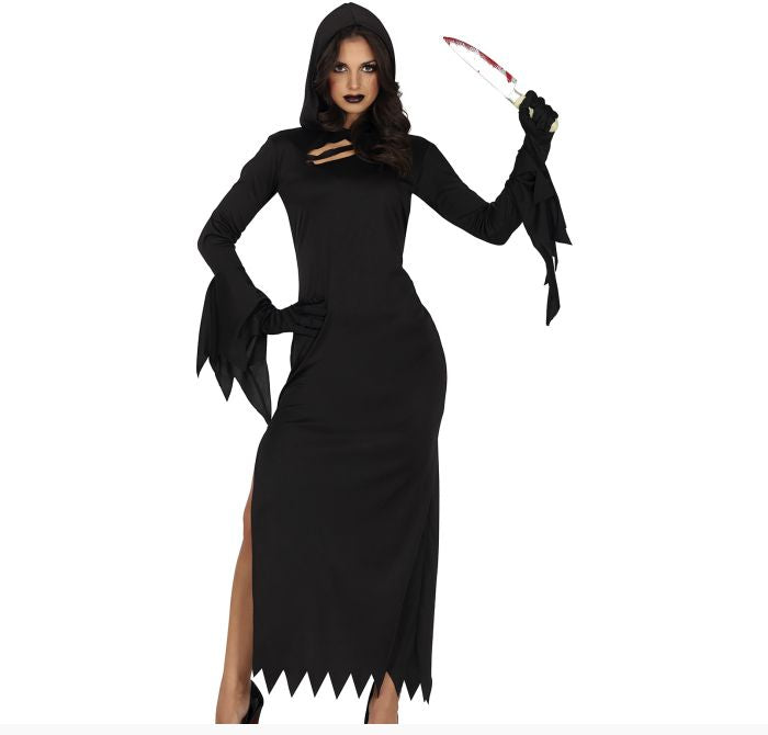 A woman modeling a black hooded gothic dress costume with long flared sleeves, black gloves, and a jagged hemline, holding a knife prop against a plain white background.