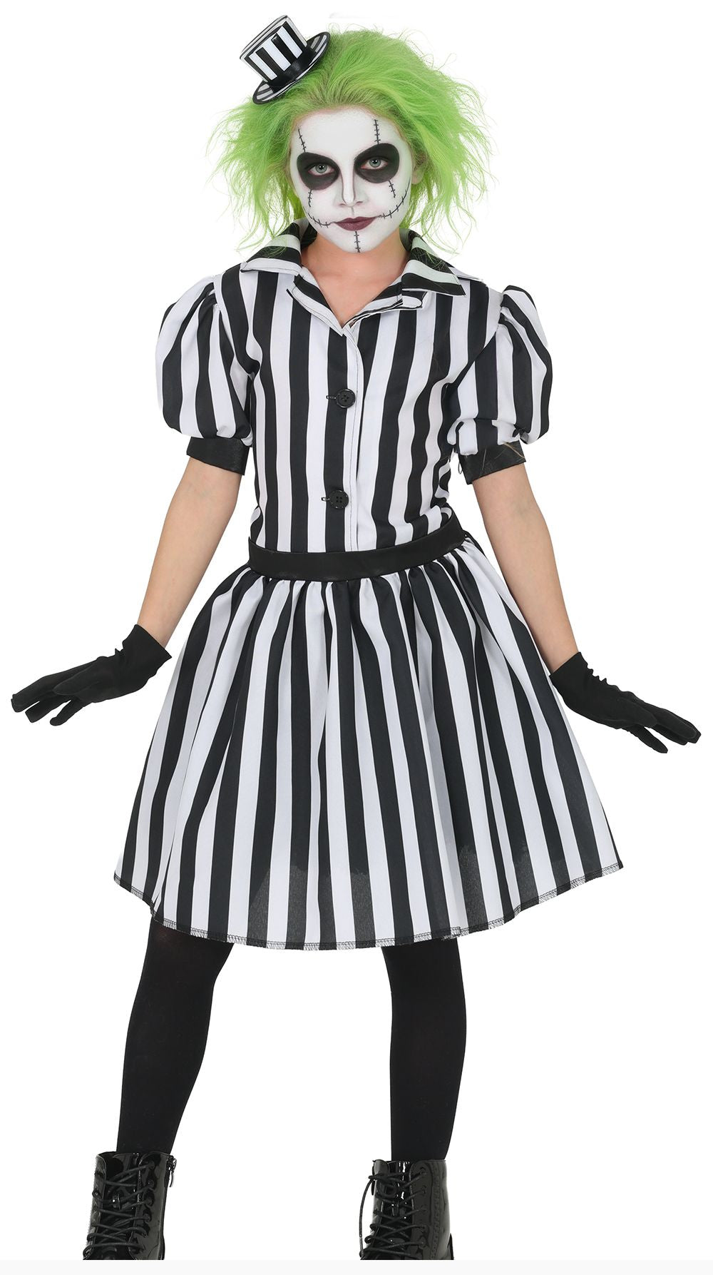A child modeling a black and white striped costume dress with a black waist belt, black gloves, black tights, bright green wig, and a small black top hat against a plain white background.