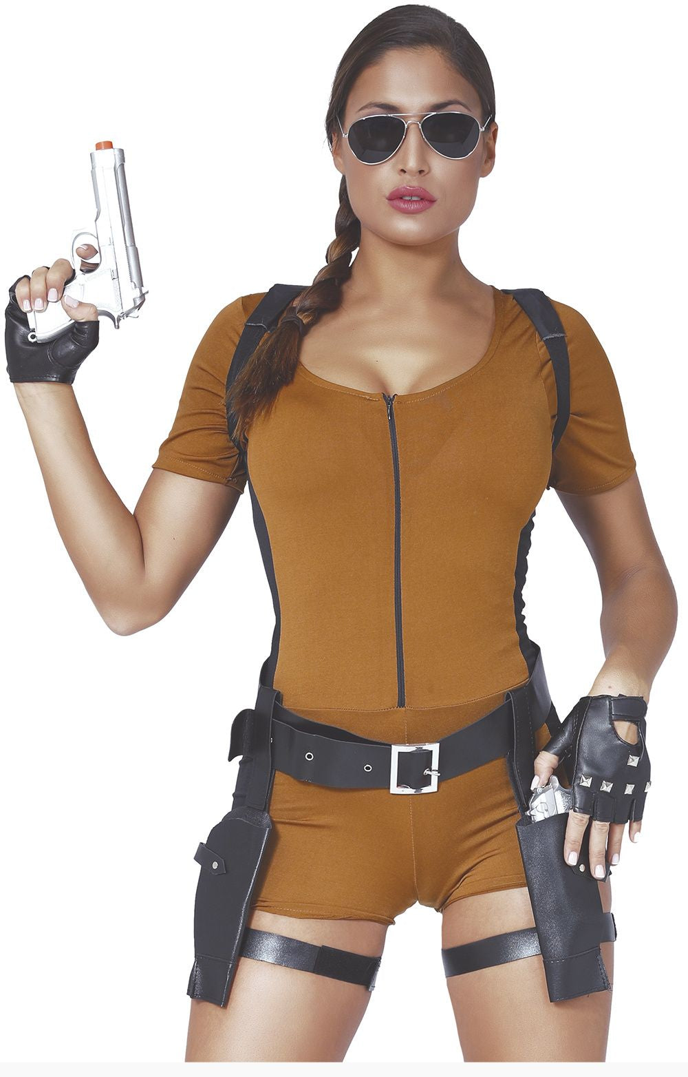 A woman modeling a brown short-sleeve zip-front bodysuit with black harness-style shoulder straps, a black waist belt with silver buckle, black fingerless gloves, and black thigh straps, holding a silver pistol prop against a white background.