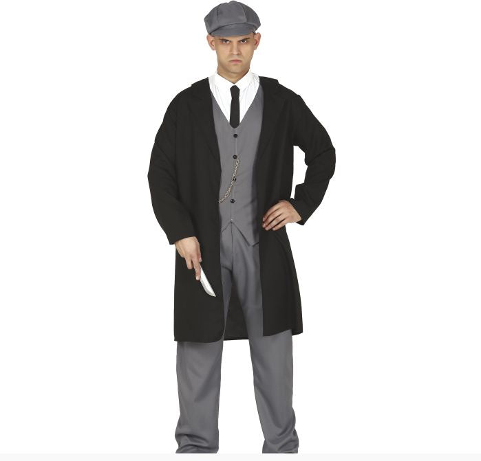 A man modeling a vintage-style costume consisting of a long black coat over a gray three-piece suit, white shirt, black tie, and gray flat cap, holding a silver knife prop against a white background.