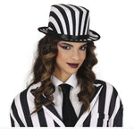 A woman wearing a black and white striped top hat and matching striped blazer with a white shirt and black tie, photographed against a plain white background.