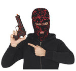 A person wearing a black and red splattered balaclava mask and a black zip-up hoodie holds a toy pistol in one hand and points with the other toward the chest. The background is plain white, with a copyright notice for Fiestas Guirca at the bottom.