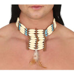A close-up of a person's neck and upper chest wearing a large statement necklace made of cream-colored bone-like beads, light blue beads, and brown wooden elements, with a feather hanging from the center. 