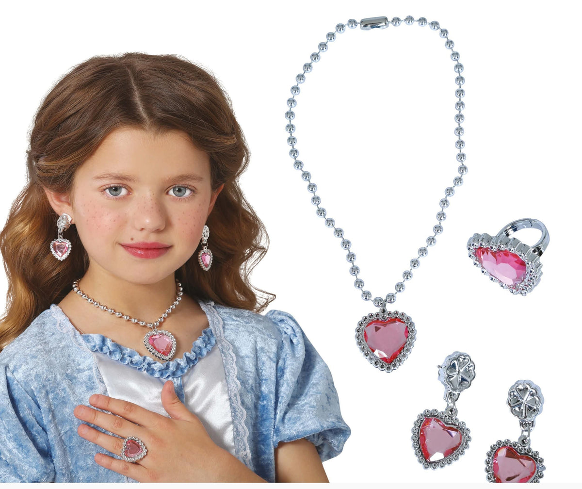 Young girl wearing a heart-shaped jewelry set with a necklace, earrings, and ring on a white background.
