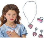 Young girl wearing a heart-shaped jewelry set with a necklace, earrings, and ring on a white background.