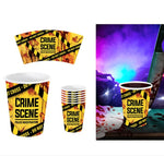 Crime scene themed paper cups and cup sleeves with a yellow and black police tape design, shown on a white background with a purple-lit themed scene on the right.