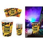 Crime scene themed paper cups and cup sleeves with a yellow and black police tape design, shown on a white background with a purple-lit themed scene on the right.