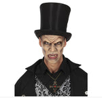 A man wearing a black vampire costume with a tall black top hat, black shirt, black-and-white damask patterned vest, and a cross necklace, shown against a plain white background.
