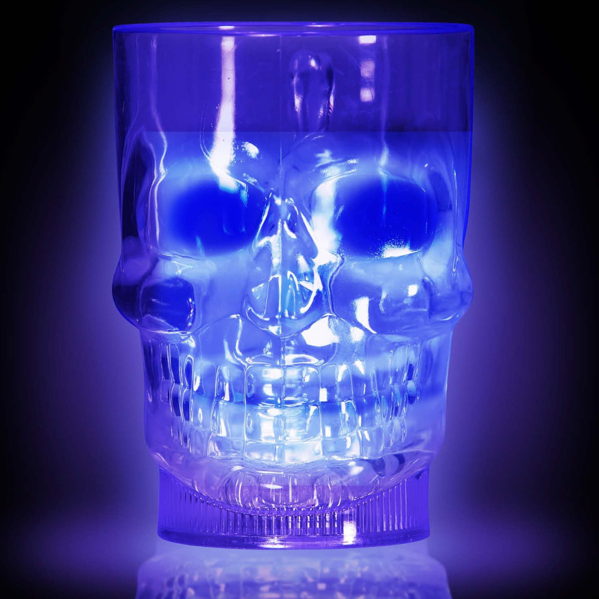 Blue LED skull-shaped glass on a black background
