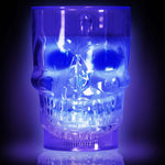 Blue LED skull-shaped glass on a black background