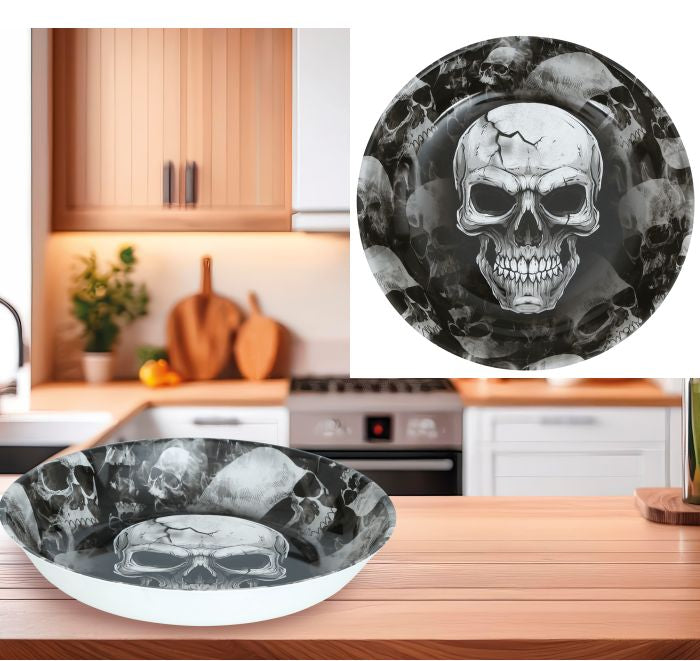 A decorative bowl with a black and white skull and crossbones pattern. A circular inset shows a close-up of the bowl's printed skull design.
