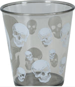 A clear plastic tumbler cup with a repeating pattern of white skulls and dark gray skull silhouettes, shown against a white background with a copyright watermark at the bottom.