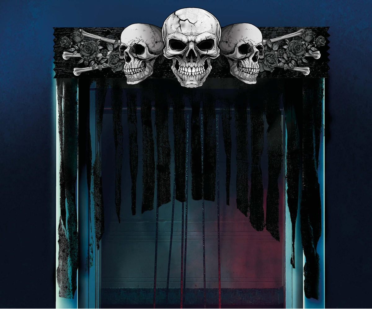 A gothic Halloween backdrop featuring three detailed skulls on a black banner at the top, flanked by crossed bones and roses, with dark dripping curtains hanging in front of a blue-lit background. A copyright notice for Fiestas Guirca s.