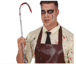 A man wearing a zombie Halloween costume with blood-splattered makeup, a cream shirt, black tie, and brown apron, holding a metal crowbar prop with red fake blood splatter, against a white background.