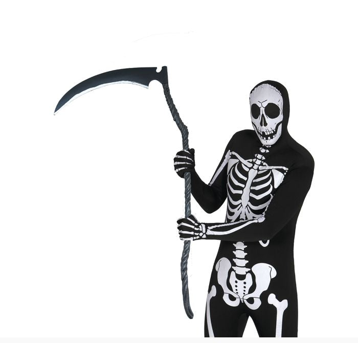 A person wearing a black full-body skeleton costume and holding a large scythe prop against a plain white background. 