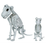 Two white dog skeleton figurines, one large and one small, shown on a plain white background with a copyright notice for Fiestas Guirca s.j.