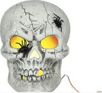 A decorative skull Halloween decoration with a textured gray stone-like finish, black plastic spiders on the forehead and eye sockets, and glowing yellow lights in the eye sockets and behind the teeth, shown on a white background.
