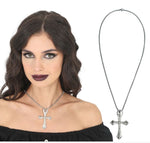 A silver-toned cross pendant necklace with clear rhinestones, shown worn by a woman on the left and as a standalone product shot on the right against a white background. 