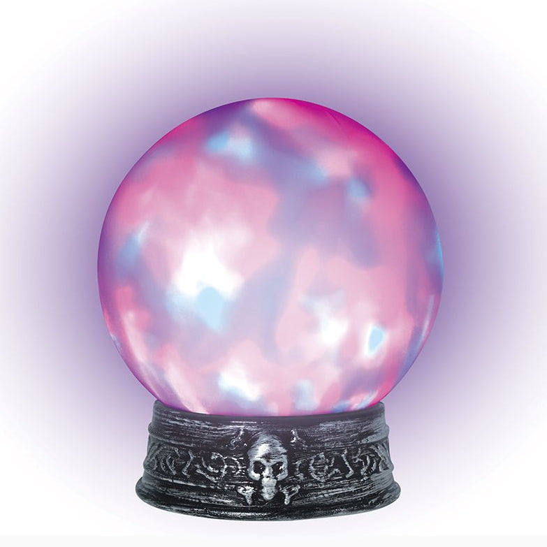 A decorative crystal ball with a pink and blue marbled pattern, resting on an ornate dark metal base with a skull detail, set against a white background with a purple glow.