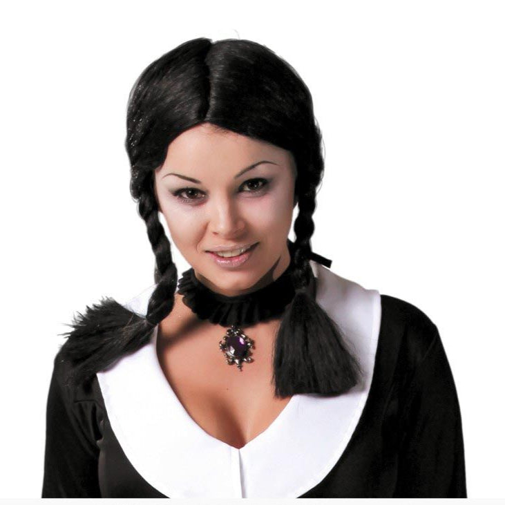 Person wearing a black wig with braided pigtails on a white background