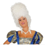 A woman wearing a historical costume with a large white powdered wig and a blue and gold patterned dress, photographed against a plain white background.