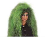 A person wearing a voluminous, curly green wig and theatrical face makeup, photographed against a plain white background. 