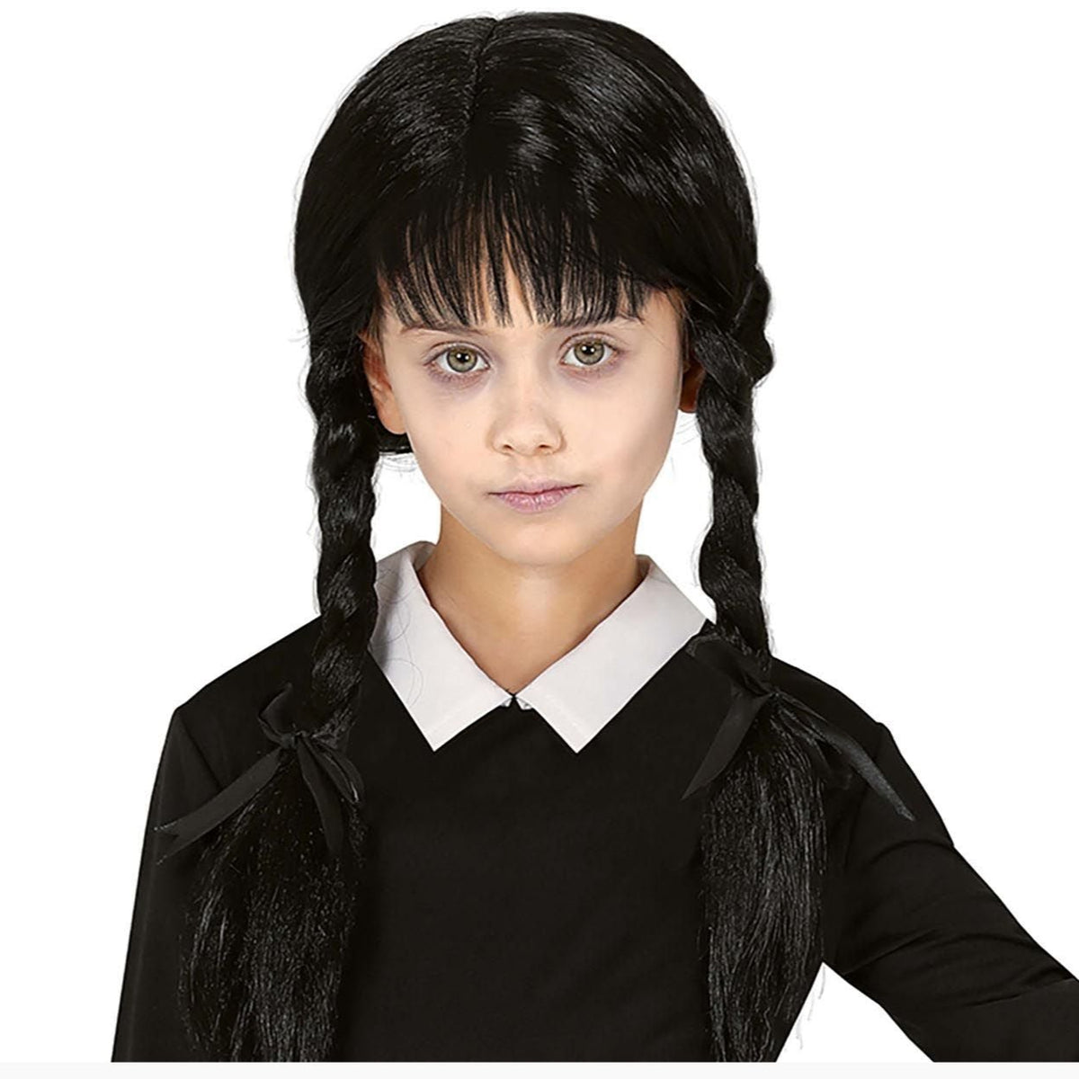 Person wearing a black wig with braids on a white background