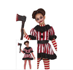 A child model wearing a creepy clown costume with red and white vertical stripes, black ruffled collar and hem, striped tights, and holding a toy axe.