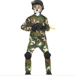 A child modeling a military camouflage costume set, including a long-sleeve shirt, pants, knee pads, and a black helmet with a skull-print face mask, holding a toy rifle against a white background.