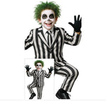 A child modeling a black and white striped costume resembling the character Beetlejuice, with green hair, black face paint, a striped shirt, striped jacket, striped pants, and black gloves. 