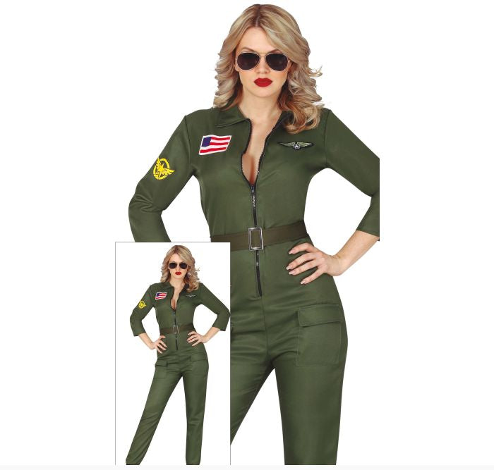 A woman modeling an olive green military-style jumpsuit costume with a front zipper, belt, patch details, and a small inset showing the full outfit. The image has a white background and a copyright notice for FIESTAS GUIRCA s.