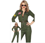 A woman modeling an olive green military-style jumpsuit costume with a front zipper, belt, patch details, and a small inset showing the full outfit. The image has a white background and a copyright notice for FIESTAS GUIRCA s.