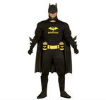 A man wearing a black Batman costume with a cowl, cape, utility belt, and gloves, standing against a plain white background. The costume has yellow Batman logos and text on the chest and belt, with red accents on the belt.