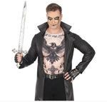 A man modeling a gothic vampire costume consisting of a black faux-leather trench coat, a black raven graphic print shirt, black fingerless gloves, and a black belt, while holding a silver toy sword against a white background.