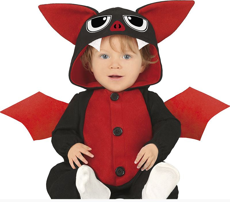 Child wearing a red and black bat costume with large ears and wings on a white background.