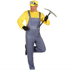A man modeling a yellow and blue Minions costume, featuring a yellow long-sleeve shirt, blue denim-style overalls, a yellow cap with cartoon eyes, black gloves, and a pickaxe prop, against a plain white background.