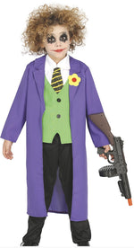 Child in a colorful costume with a purple coat and green vest, holding a toy gun on a white background.