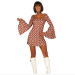 Woman wearing a patterned dress with long sleeves on a white background