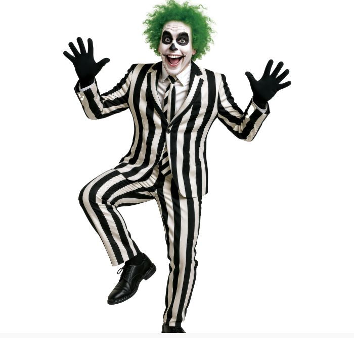 A person modeling a costume with a black-and-white vertically striped suit, black gloves, black shoes, green hair, and white face makeup with black eye makeup, posed against a plain white background.