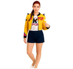 Woman wearing a yellow jacket with colorful accents and a 'K Pop' shirt on a white background